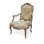 A French 19th century carved walnut fauteuil a la Reine in the Louis XV style