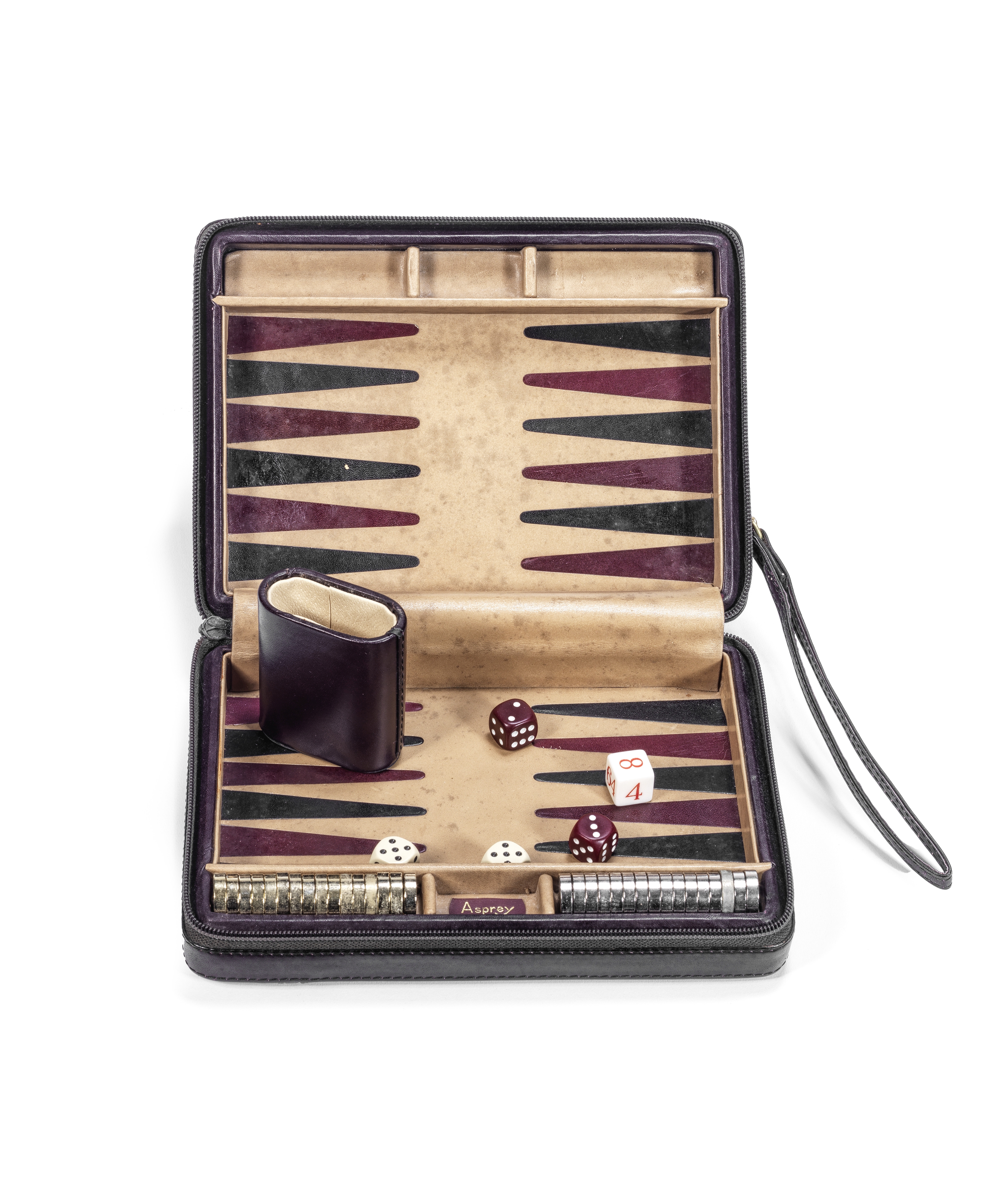 A late 20th century leather travelling backgammon set retailed by Asprey, London