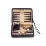A late 20th century leather travelling backgammon set retailed by Asprey, London