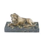 A late 19th / early 20th century 'Grand Tour' type patinated bronze model of a recumbent lion