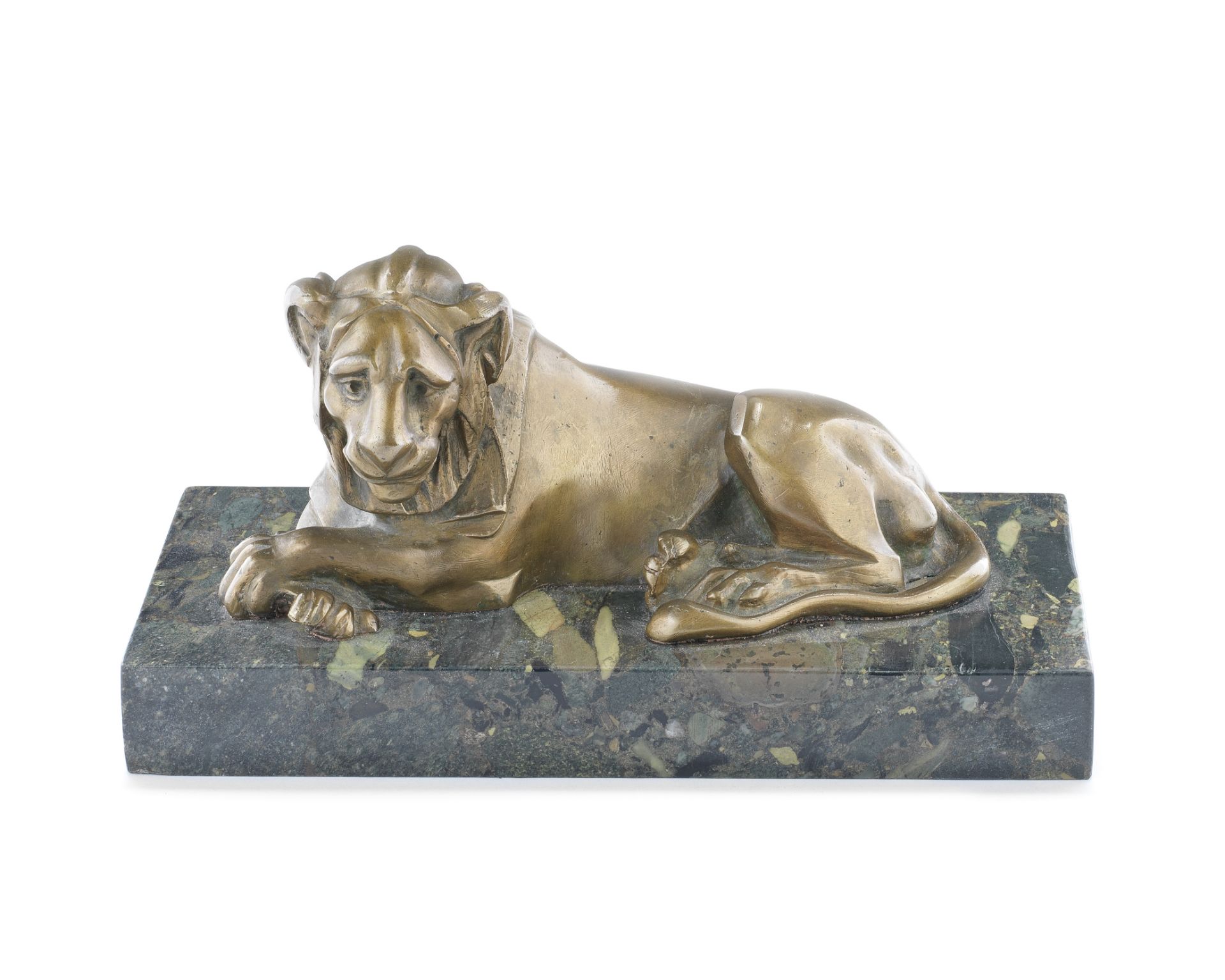 A late 19th / early 20th century 'Grand Tour' type patinated bronze model of a recumbent lion