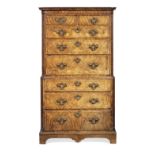 A George II figured walnut and featherbanded chest on chest