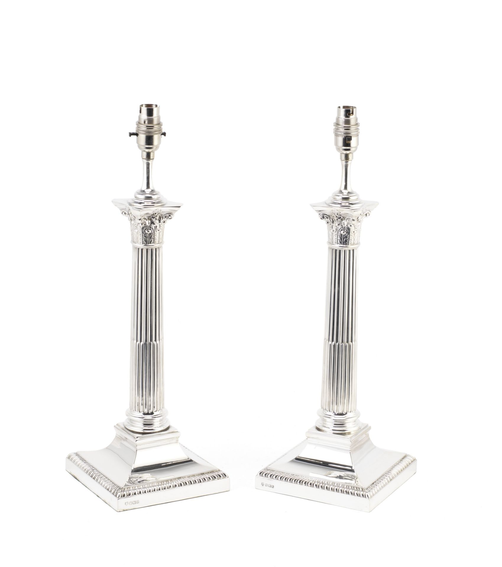 A pair of silver table lamps Hawksworth Eyre & Co Ltd, Sheffield 1913 and 1924 (2)