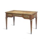 A French late 19th century gilt bronze mounted mahogany and parquetry bureau plat after the model...