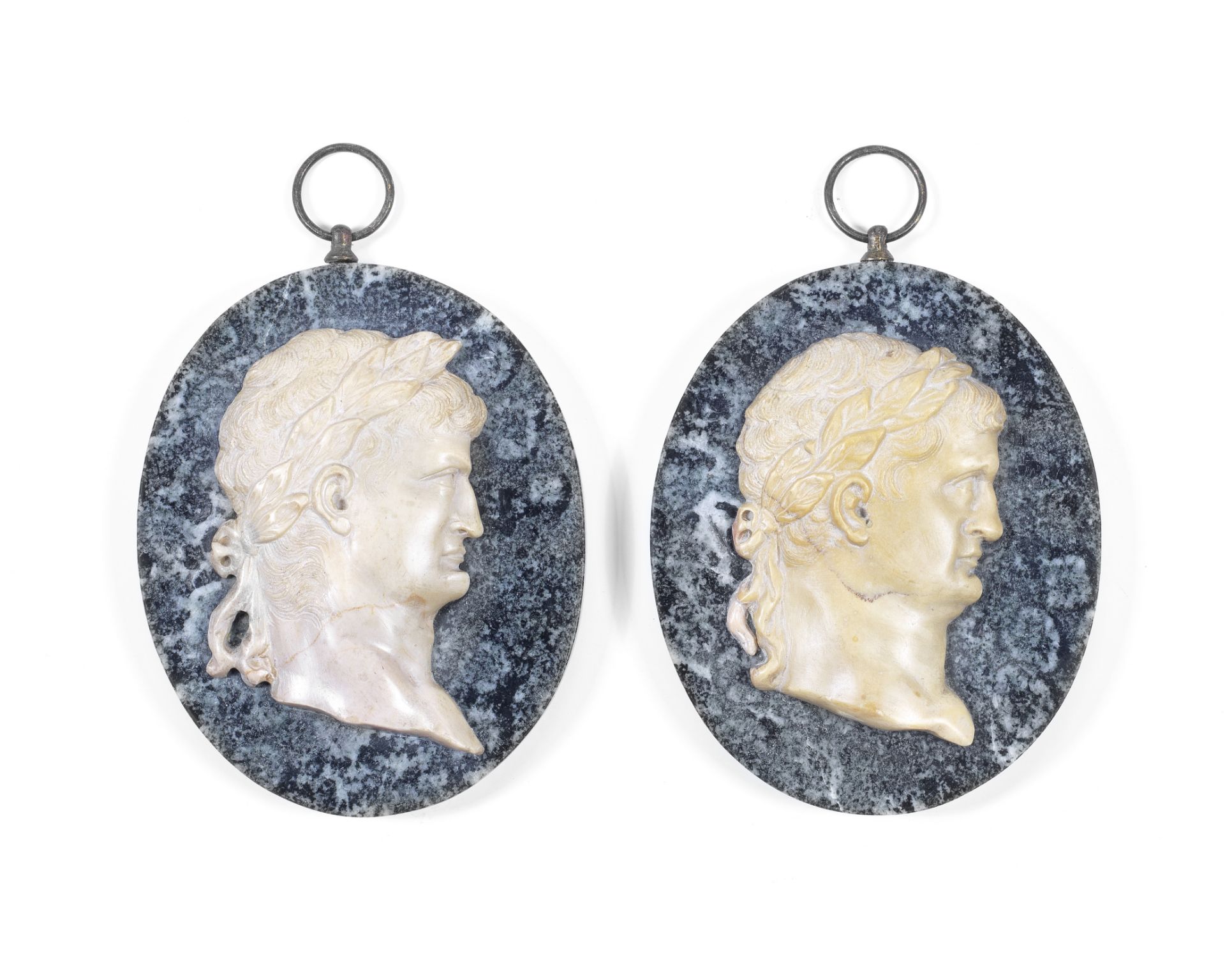 A pair of 19th century Italian 'Grand Tour,' Giallo Antico marble portrait reliefs of Roman emper...