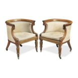 A pair of Regency rosewood 'curricle' or 'curule' bergeres (2)