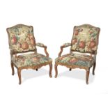 A pair of early Louis XV carved beech fauteuils (2)
