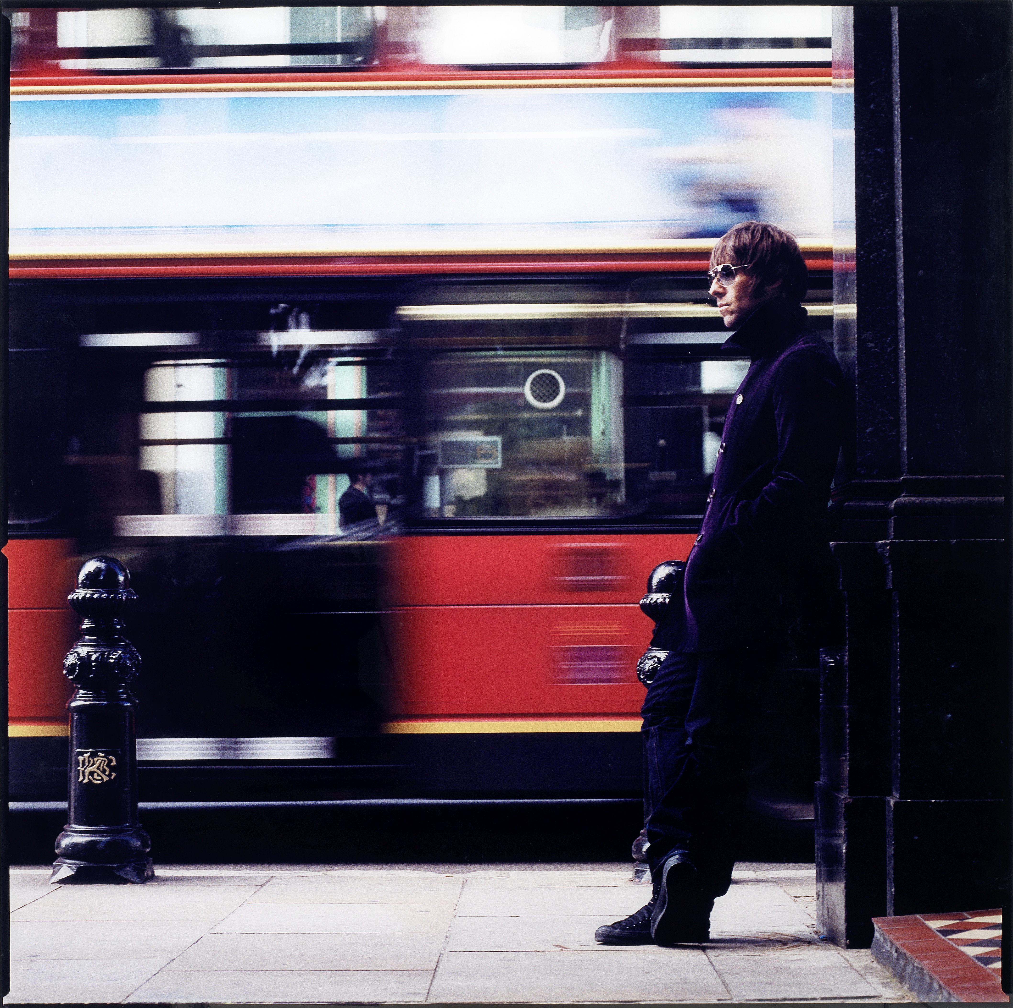 Lawrence Watson (British, born 1963) Liam Gallagher with London bus, London, 1990s, printed later