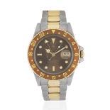 Rolex. A stainless steel and gold automatic calendar bracelet watch with dual time zone GMT Mast...