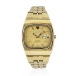 Omega. An 18K gold quartz calendar tonneau form bracelet watch with sigma dial Constellation Meg...