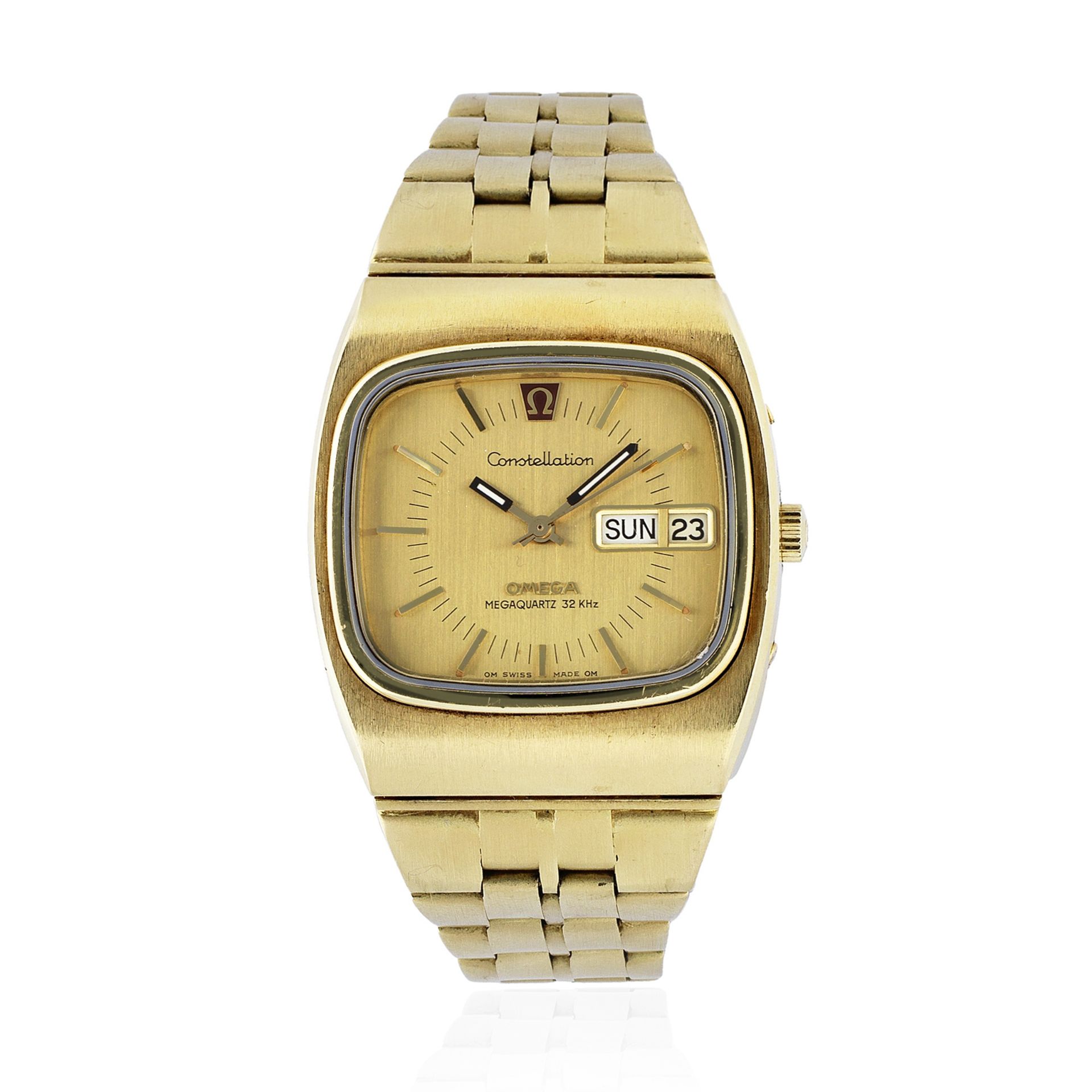 Omega. An 18K gold quartz calendar tonneau form bracelet watch with sigma dial Constellation Meg...