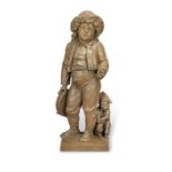 An early 20th century Continental painted terracotta figural group of a young urchin boy and his ...