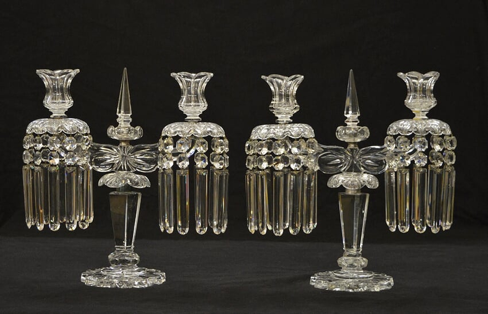 A pair of cut and moulded clear glass twin light lustre candelabra (2)