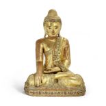 A Burmese carved and giltwood figure of the seated Buddha probably 19th / early 20th century