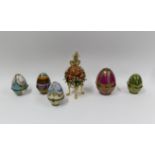 A collection of six Faberge and Russian style decorative enamel and porcelain eggs