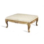A large early Victorian Rococo revival giltwood stool