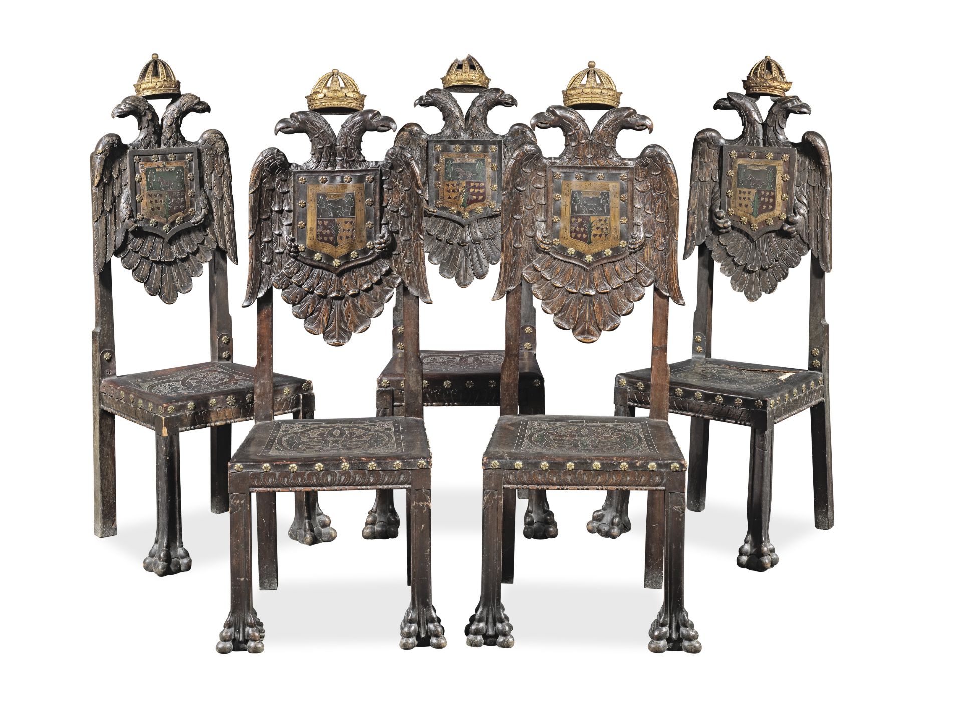 An unusual set of five Spanish early 20th century stained wood, embossed leather and parcel gilt ...