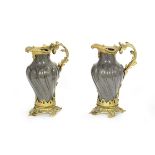 A pair of mid 19th century continental gilt bronze mounted faux grey porphyry enamelled garniture...