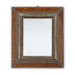 A simulated tortoiseshell and verre eglomise mirror of small size in the late 17th / early 18th c...
