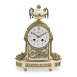 A late 19th/early 20th century French gilt bronze mounted white marble mantle clock the dial sign...