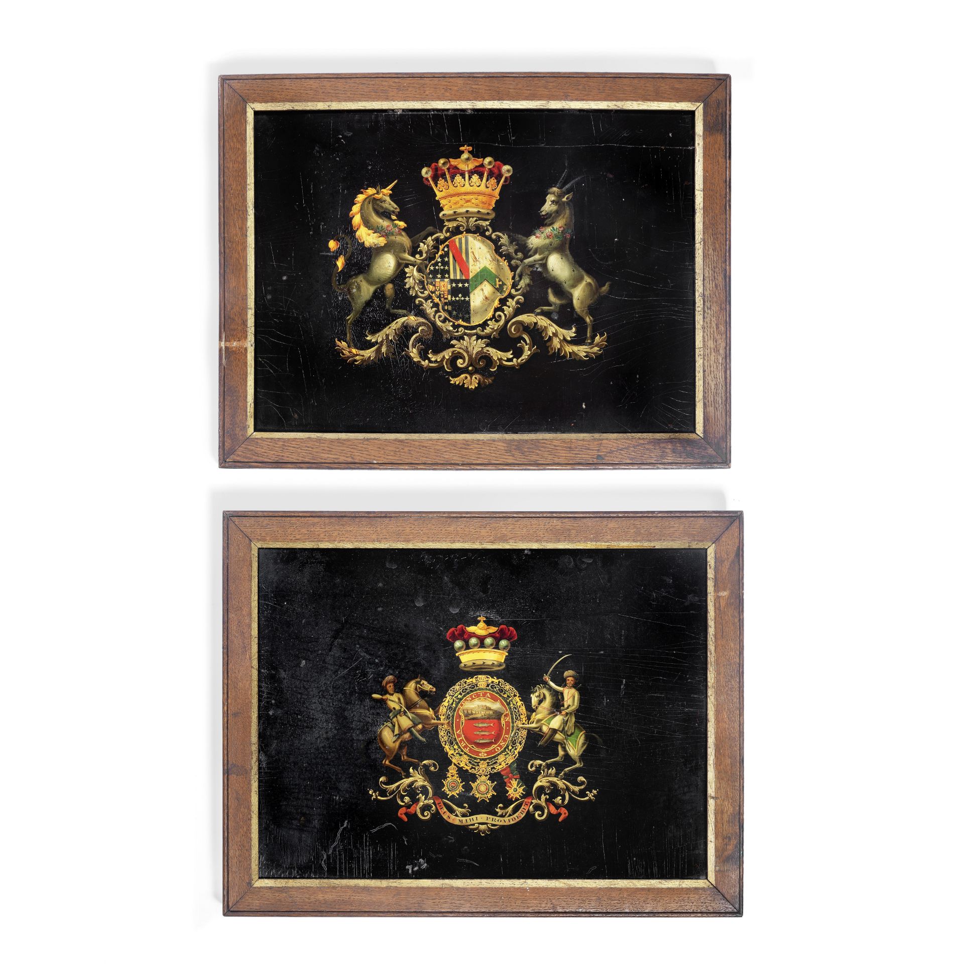 A rare pair of early 19th century crested coach panels painted with the armorial bearings of the ...