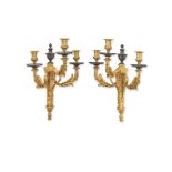 A pair of impressive early 20th century French gilt and patinated and gilt bronze three light wal...