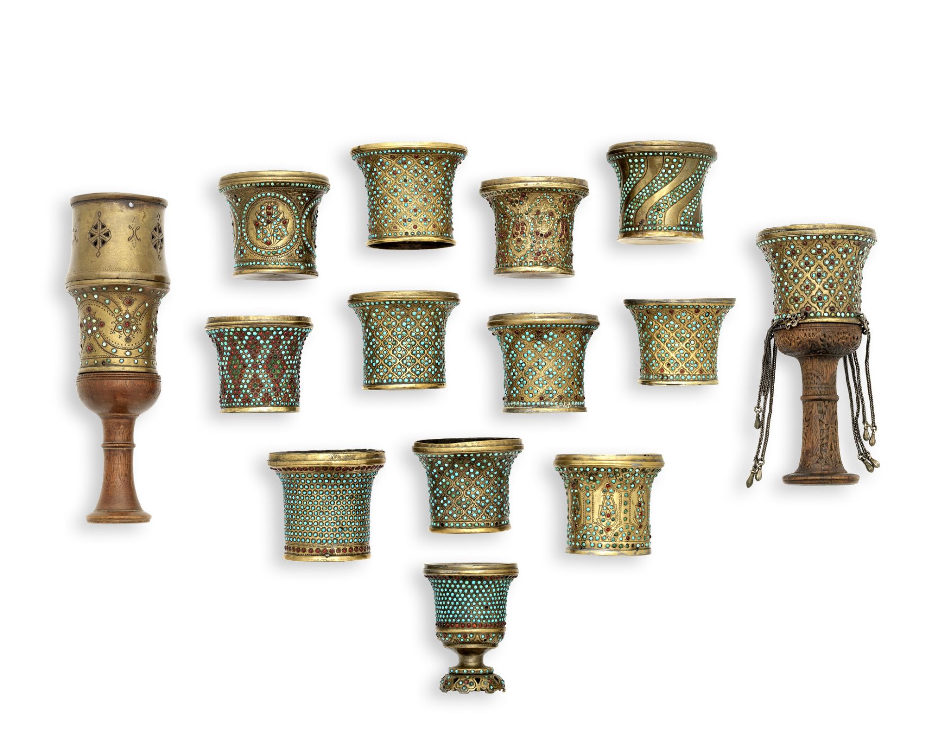 A collection of Qajar turquoise-inlaid brass ghalian cups Persia, 19th Century(14)