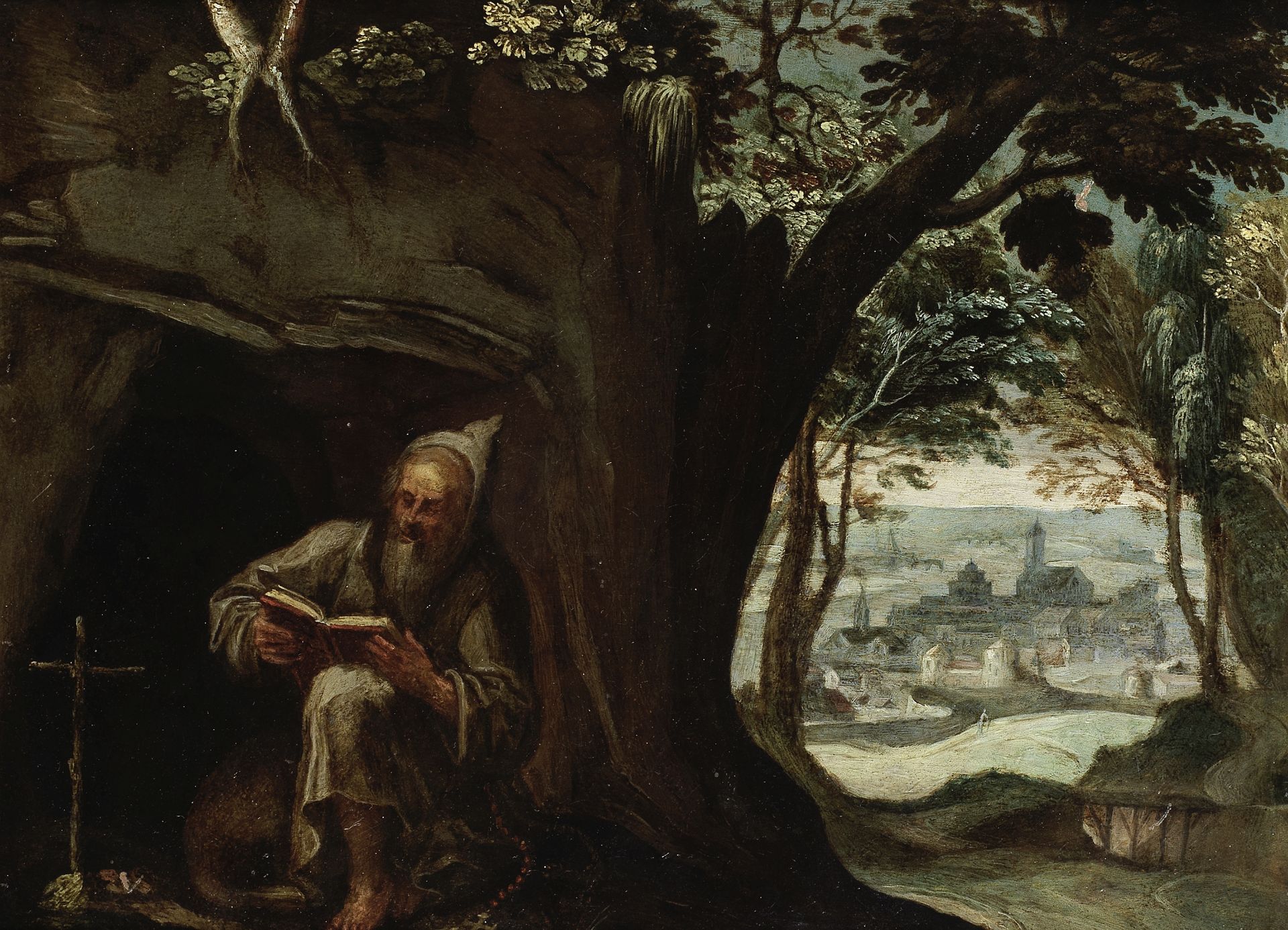 Flemish School, 17th Century A hermit seated before a cave, a landscape beyond