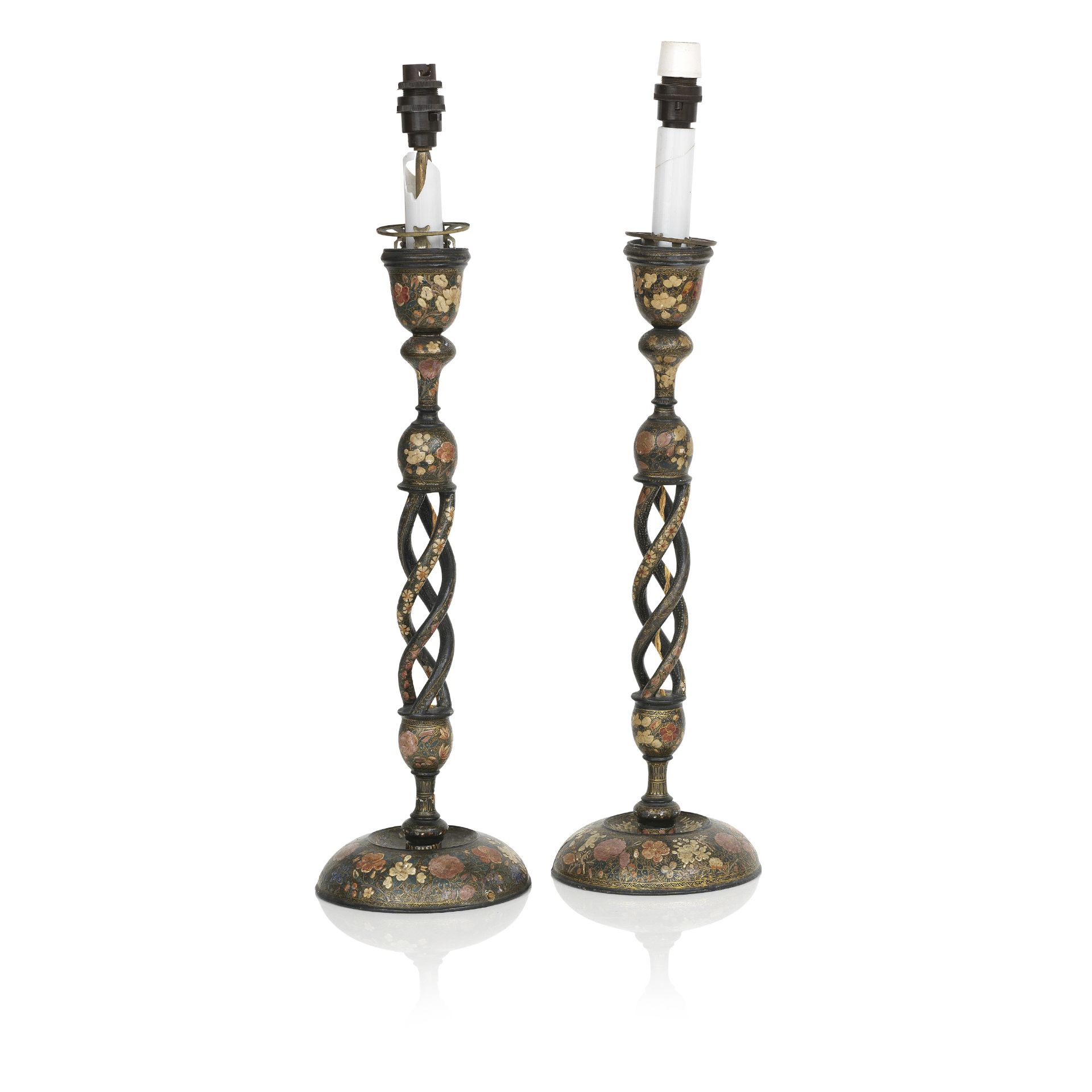 A large pair of Indian painted wood candlesticks (2)