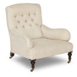 A late 19th/ early 20th century easy armchair In the manner of Howard & Sons