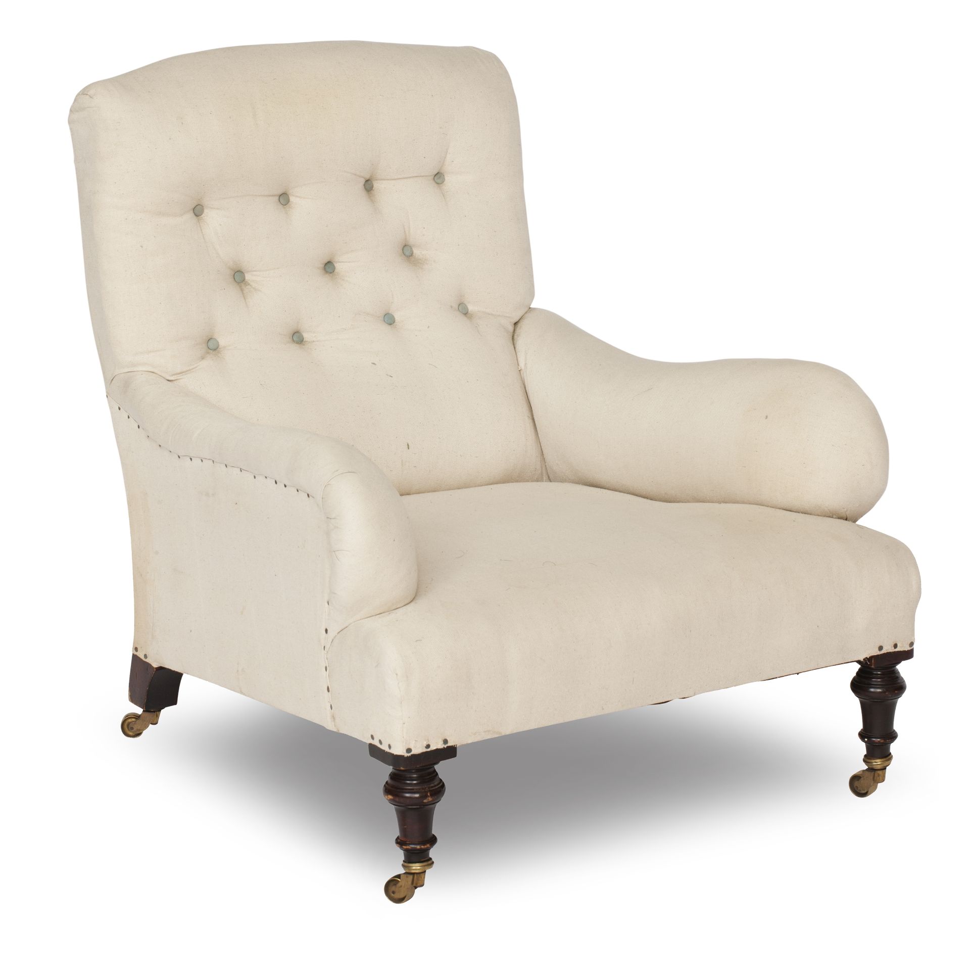 A late 19th/ early 20th century easy armchair In the manner of Howard & Sons