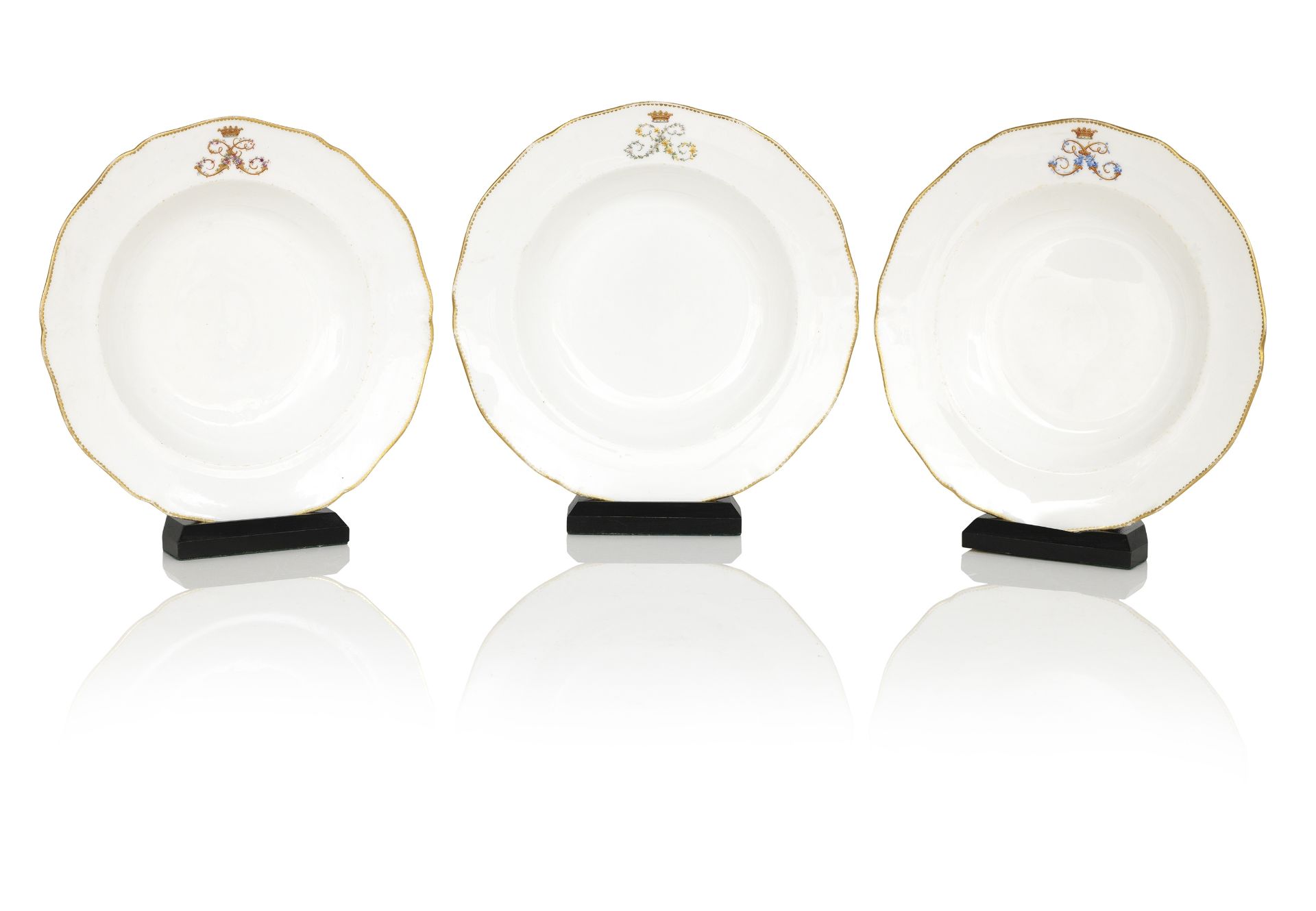 A set of thirty-five Sutherland gilt porcelain soup plates