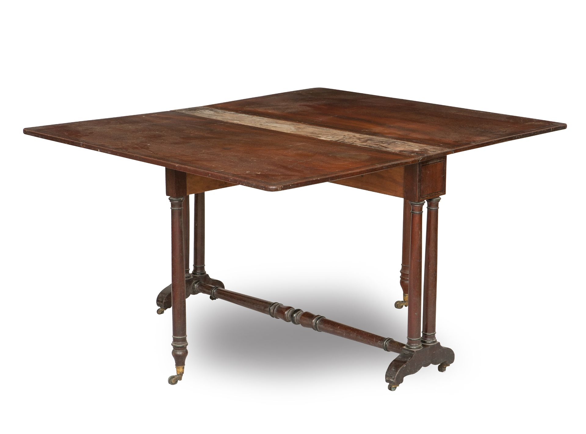 A late Victorian mahogany and ebonised line inlaid Sutherland table