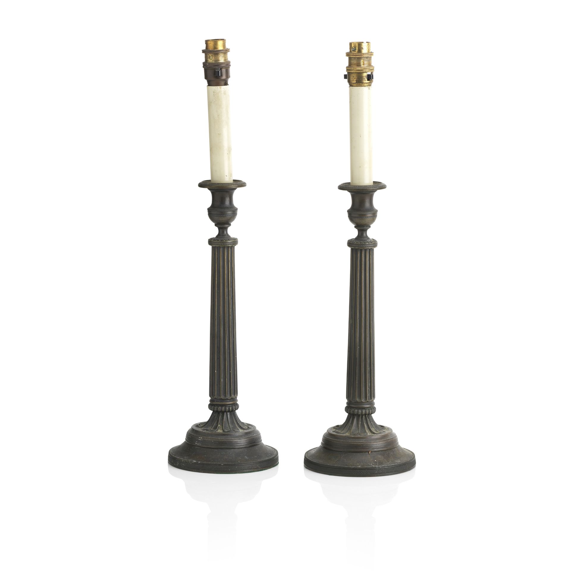 A pair of early 19th century French cast bronze candlesticks (2)