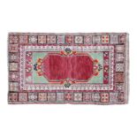 A group of three oriental rugs 161cm x 100cm; 177cm x 105cm and 185cm x 98cm