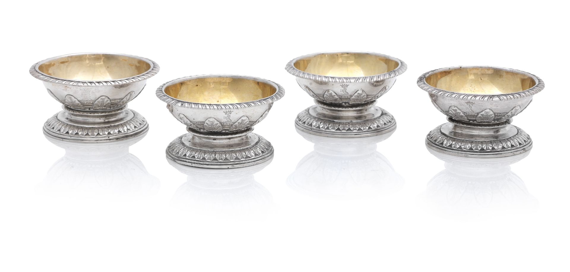 A matched set of four George II style silver capstan salts one by Richard Sibley, London 1822, th...