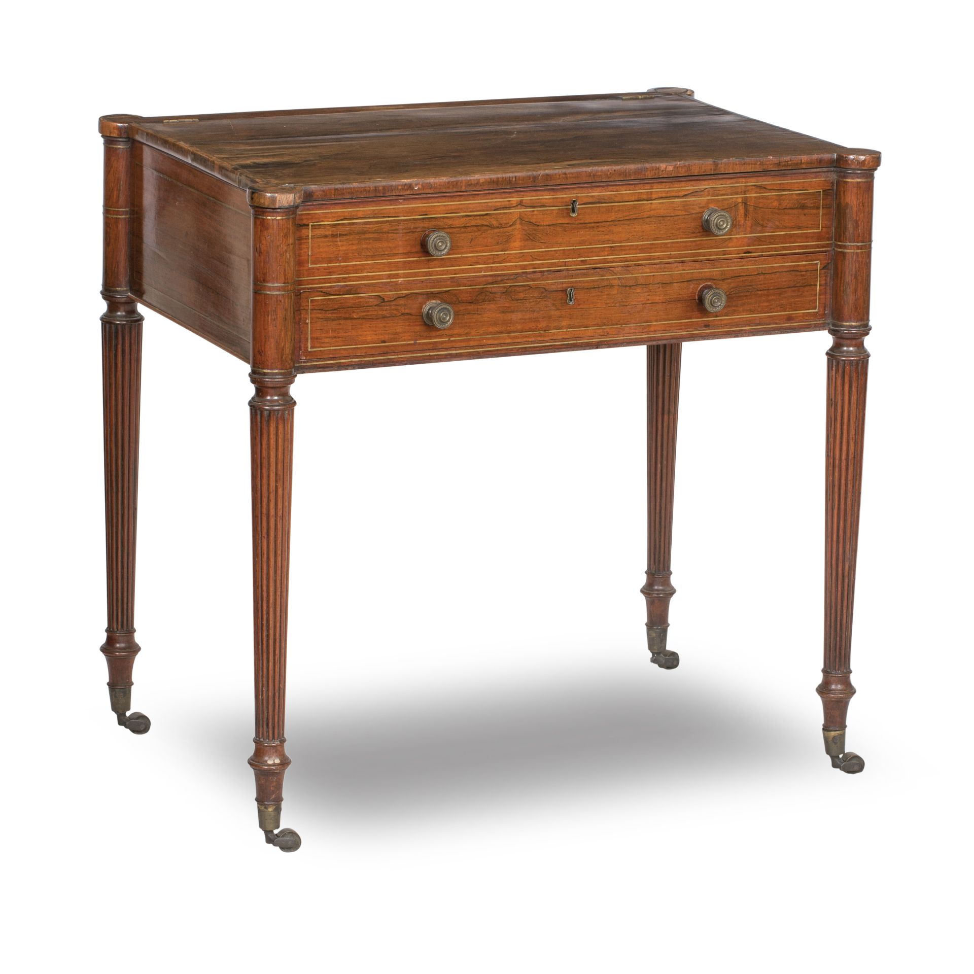 A Regency rosewood and brass inlaid writing table In the manner of Gillows