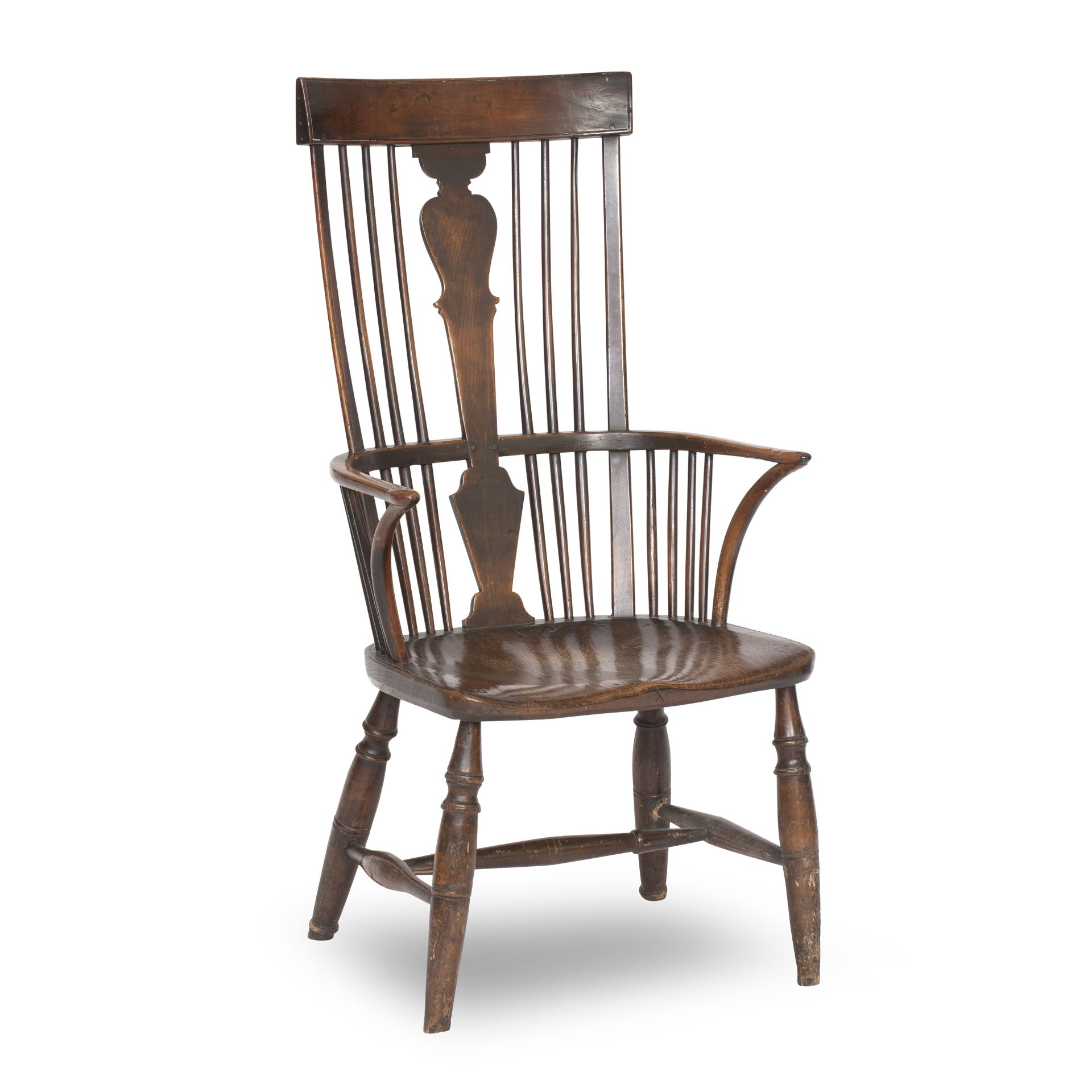 A late 19th century walnut, beech and elm comb back Windsor arm chair