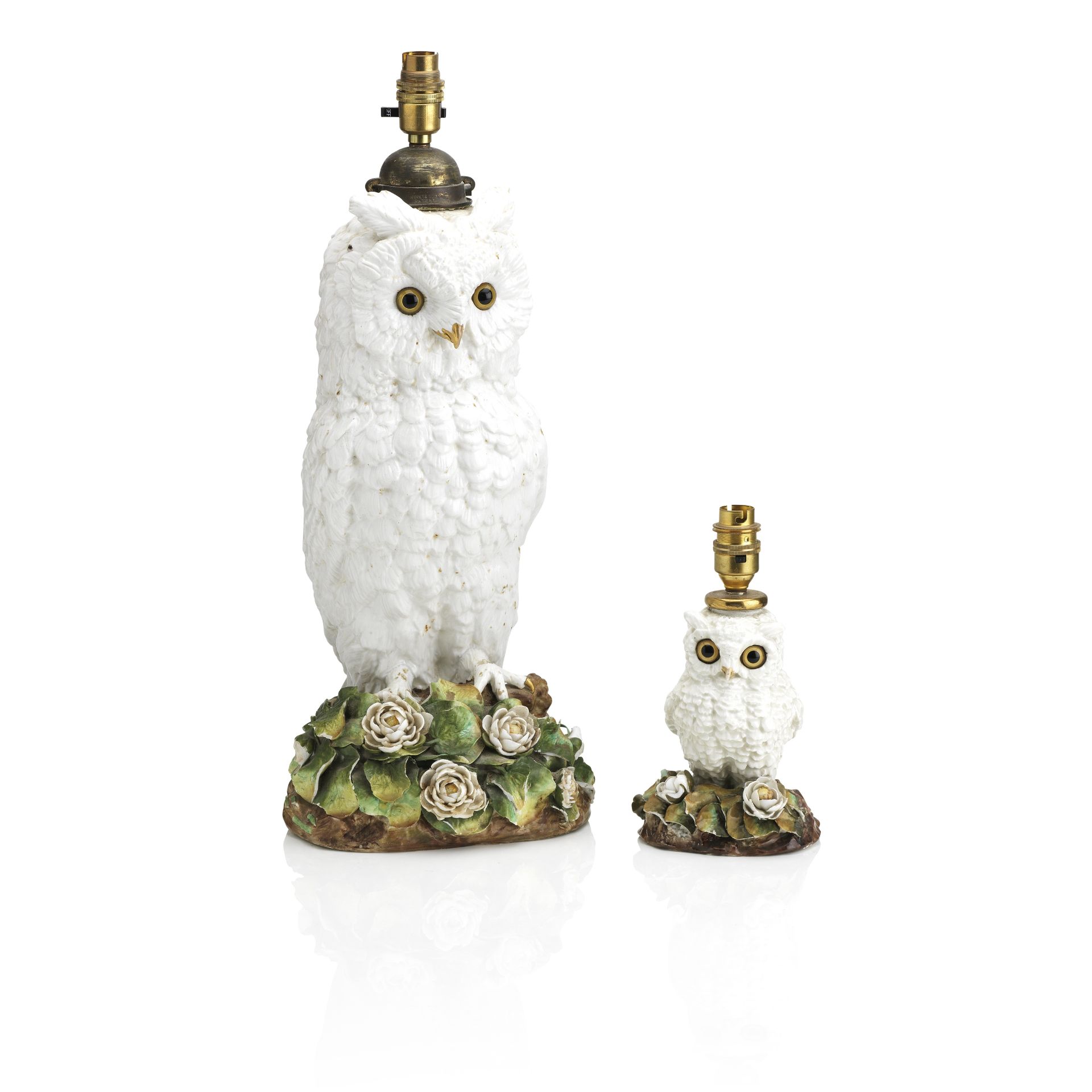 A graduated pair of Owl porcelain lamps