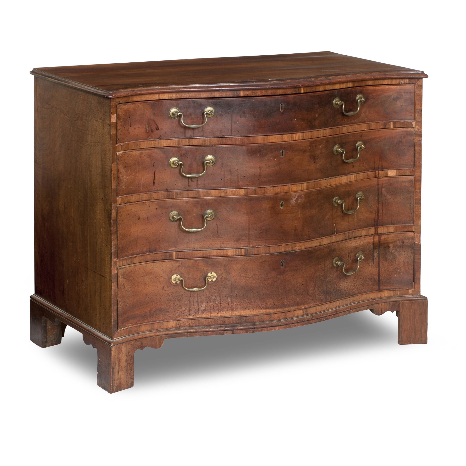 A George III mahogany serpentine chest In the manner of Thomas Chippendale