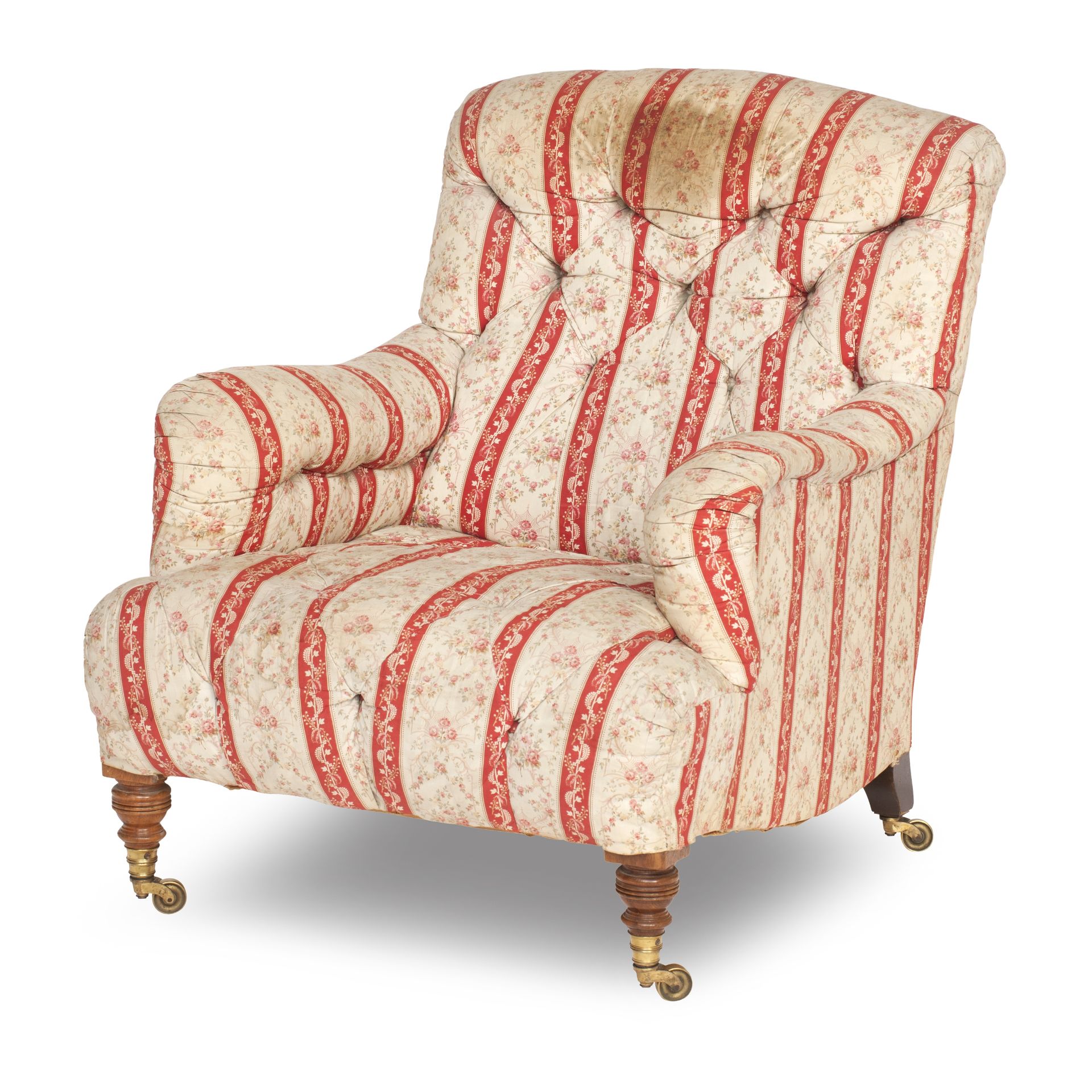 A late Victorian upholstered easy armchair Made by Howard & Sons