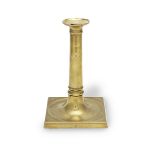 A late George III brass socket candlestick, circa 1800 Stamped 'LLOYD'S' to each corner of the base