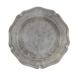 A George III pewter five lobed wavy edged armorial plate, circa 1770