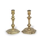 Two brass alloy socket candlesticks, circa 1725-40 (2)