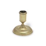 A George II brass dwarf candlestick, circa 1730-40 Possibly from a toilet service