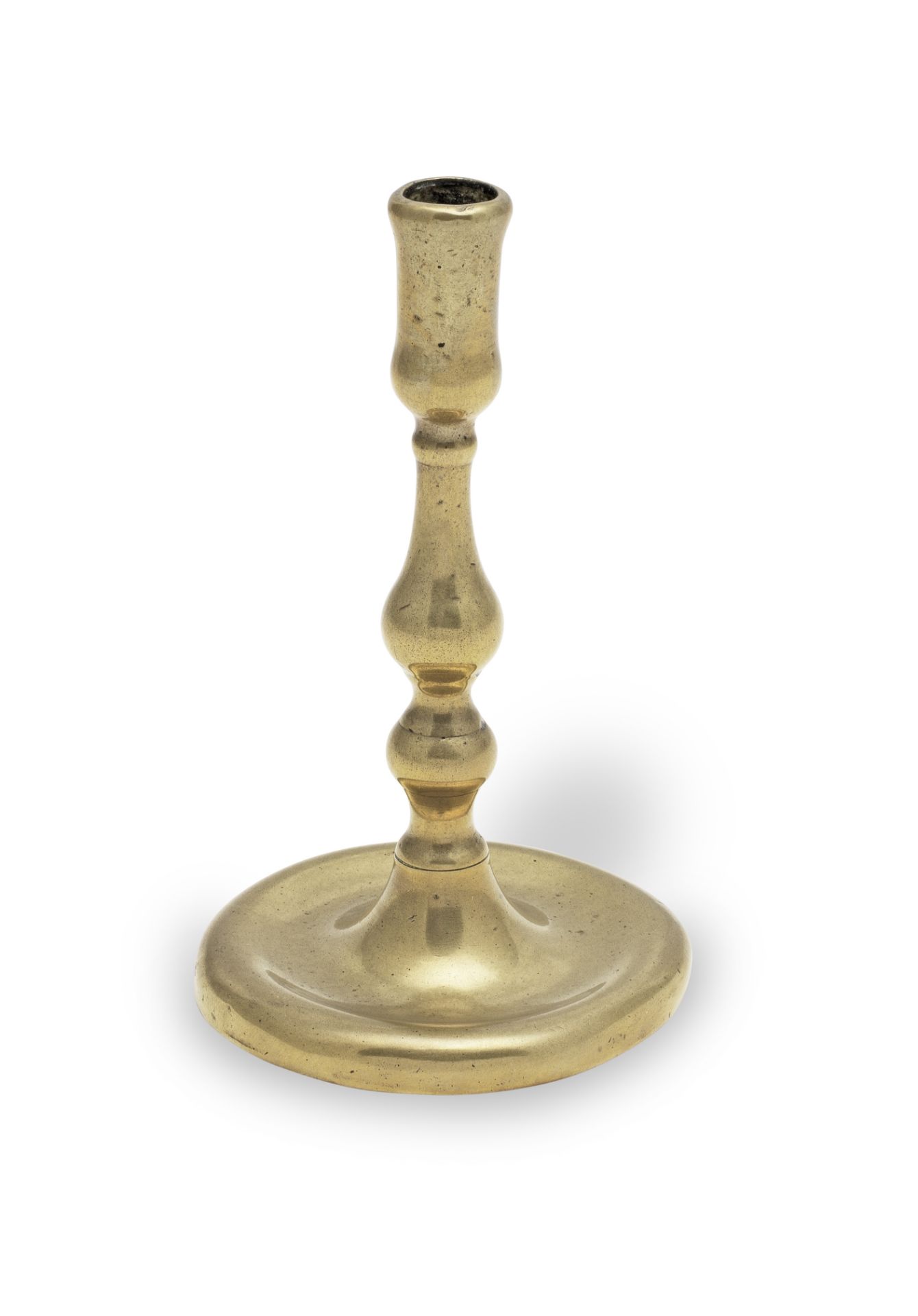 A George II brass taperstick, circa 1730