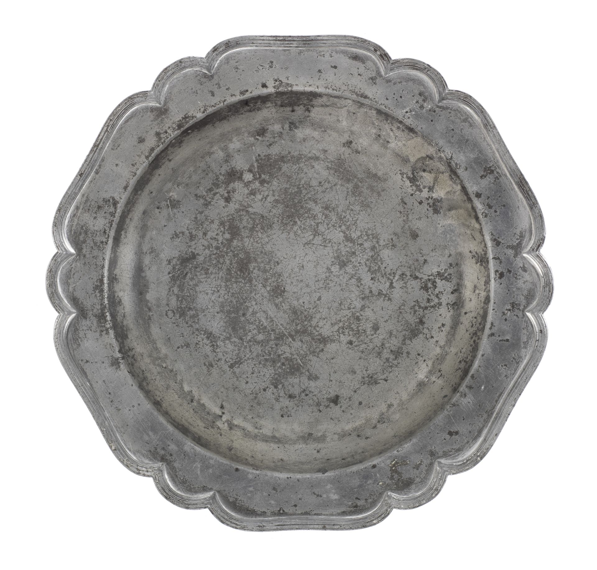 An unusual George II pewter six lobed wavy-edge plate, circa 1745