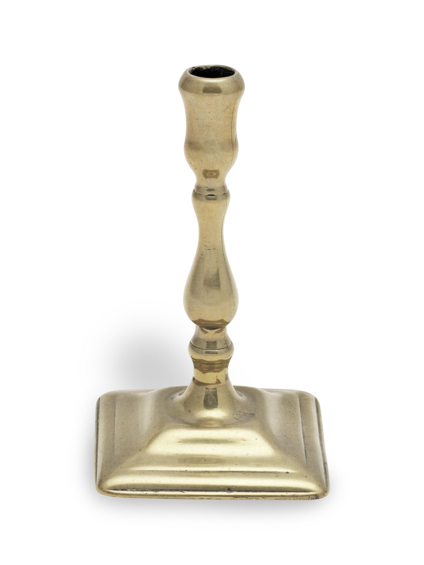 A George II brass taperstick, circa 1730-50