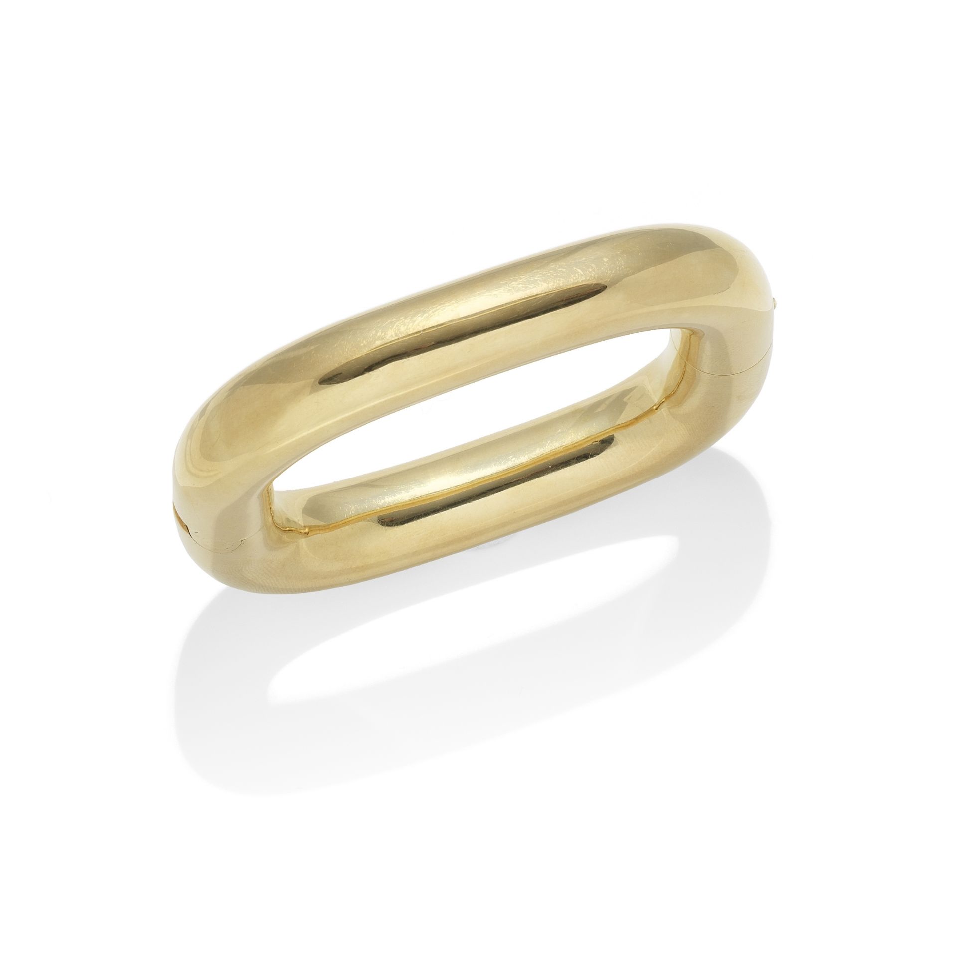 A GOLD 'TV' BANGLE, BY CARTIER,