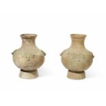 TWO LARGE RELIEF-MOULDED HAN-STYLE JARS (2)